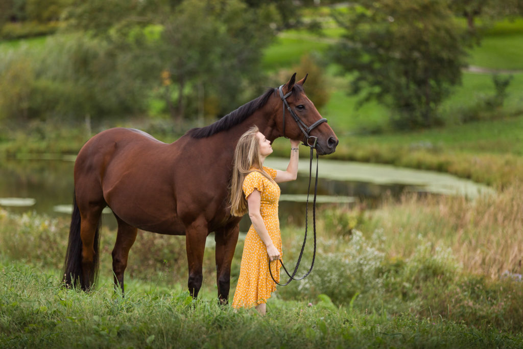 girl in yellow dress with bay horse OTTB