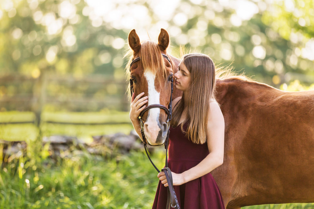 girl in burgundy dress with chestnut mare at The Black Fox Farm