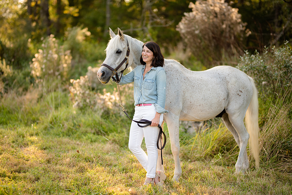 Jessica in a field with her horse Ollie