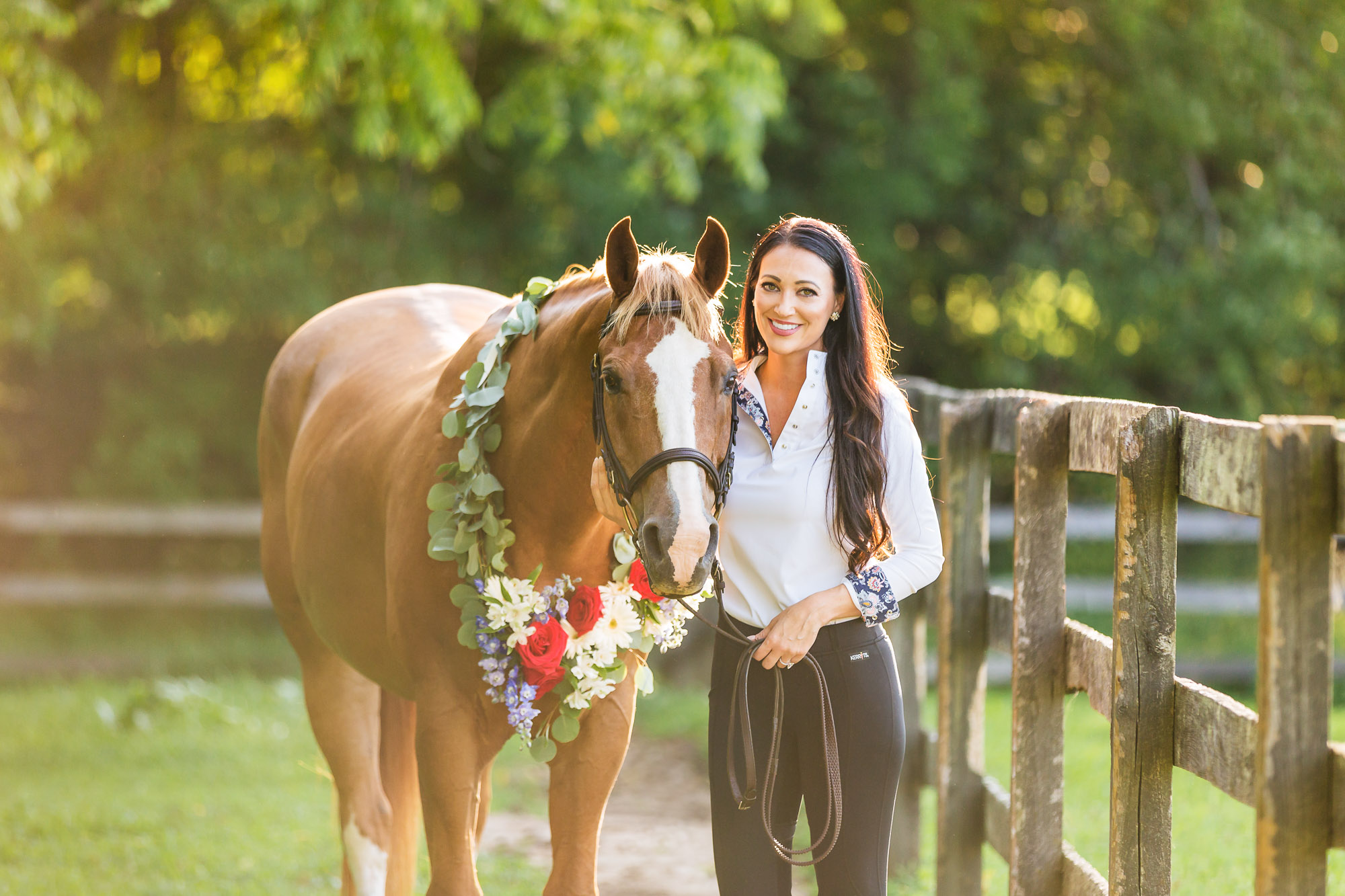 woman with horse wearing flower garland