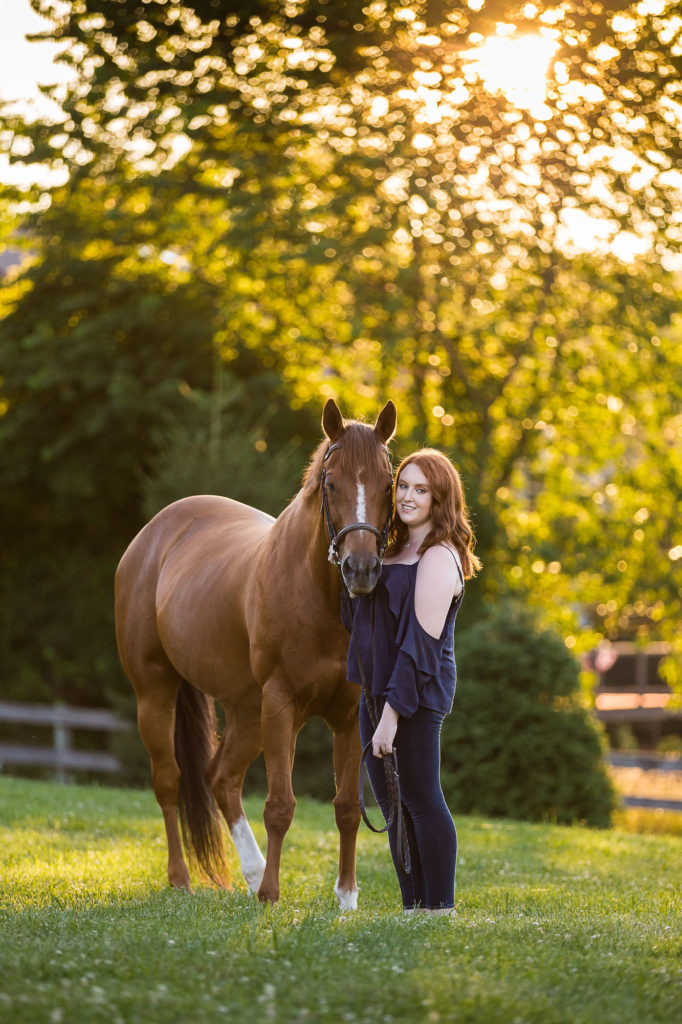 girl with red hair holding chestnut horse in Richboro PA