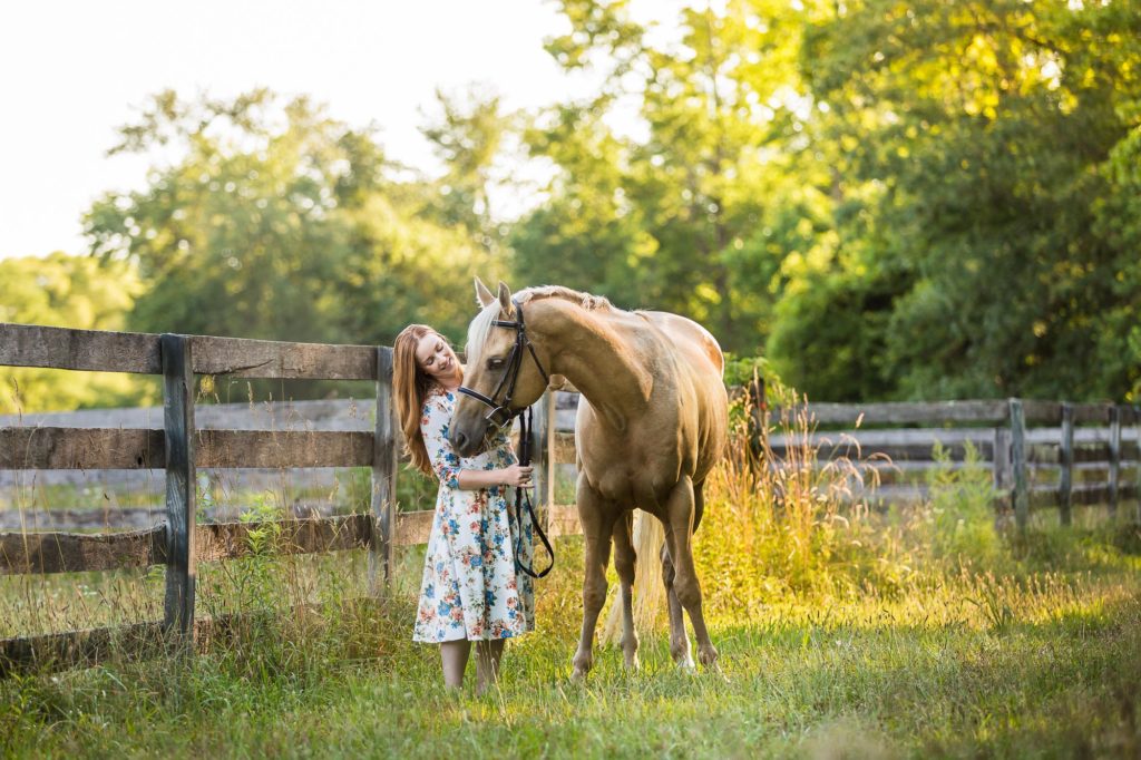 girl in flowered dress with palomino horse at Tri-Brook Equestrian Center