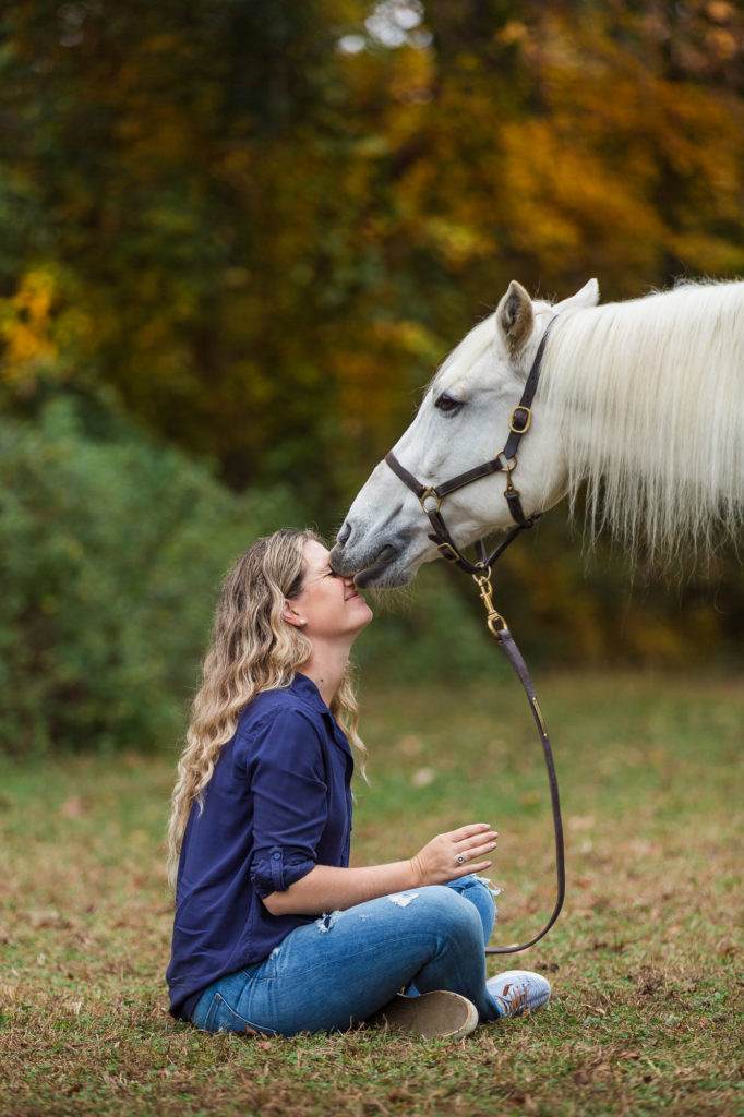 Hercules kissing Carly on the face at Winward Equestrian