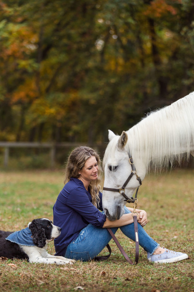 Carly with her dog Jude and her horse Hercules at Winward Equestrian