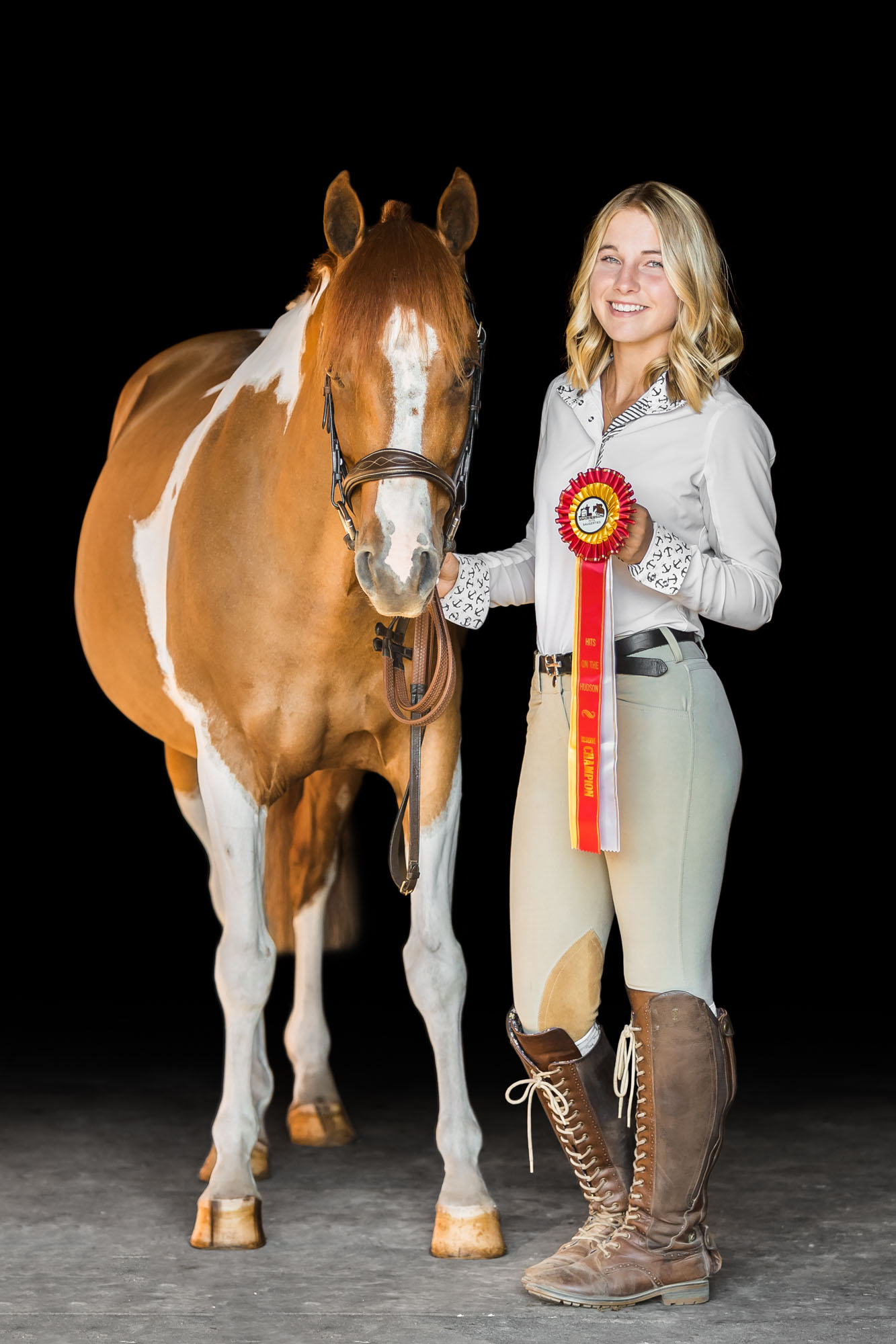 Cappy and Mallory together with one of their ribbons