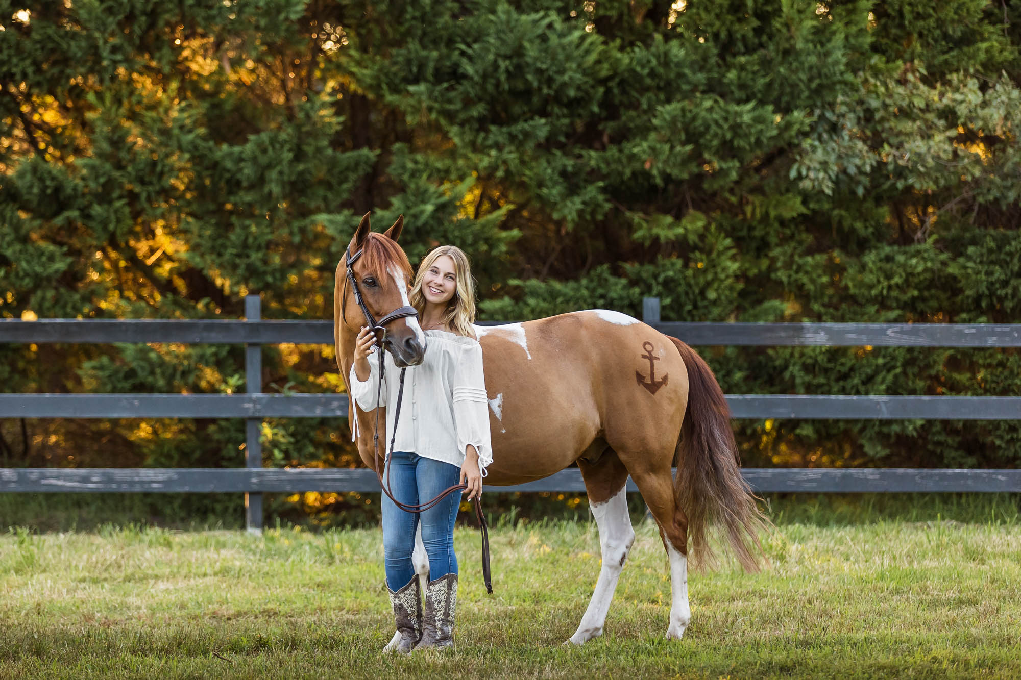 Mallory poses with Cappy at Cedar Creek Equestrian Center