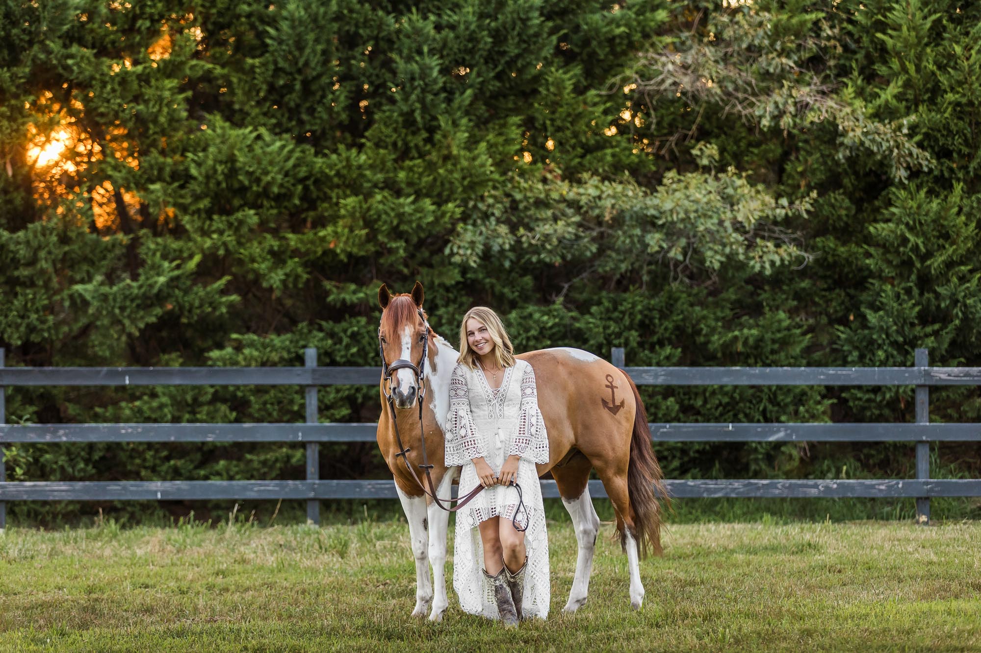 Mallory in a white dress with Cappy at Cedar Creek Equestrian Center